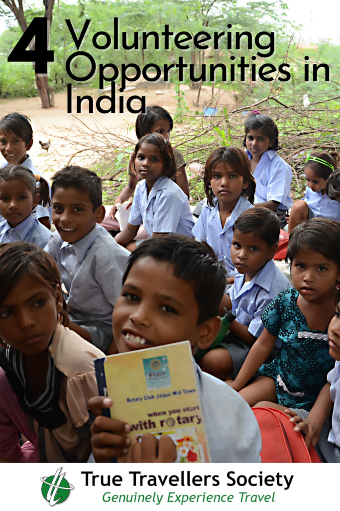 Volunteering opportunities in India - Children with work books - Cheap flights